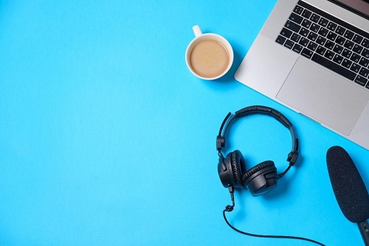 Laptop, coffee, and headphones