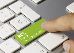 RCC Renal Cell Carcinoma Written on Green Key of Metallic Keyboard. Finger pressing key.